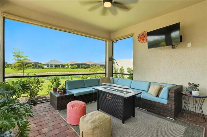 View of patio featuring outdoor lounge area and ceiling fan