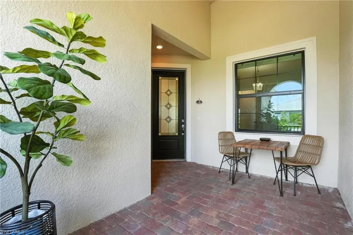 View of exterior entry featuring stucco siding