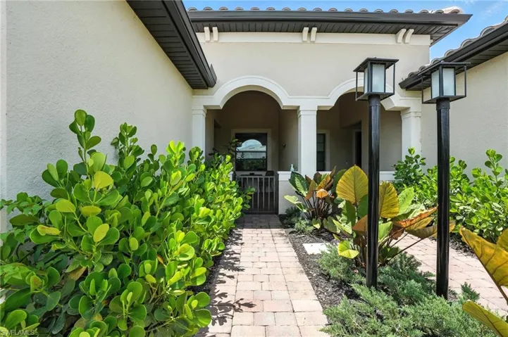 View of exterior entry featuring stucco siding