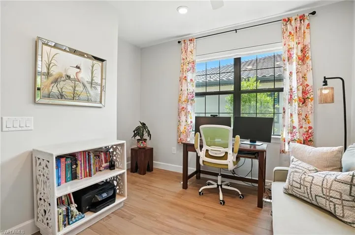 Home office featuring wood finished floors and recessed lighting