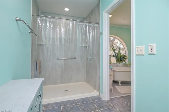 Big walk in shower and double vanities in the master bath.