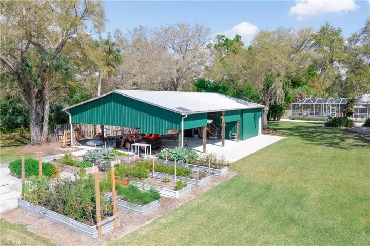 View of the 40 x 60 Barn and raised garden beds.