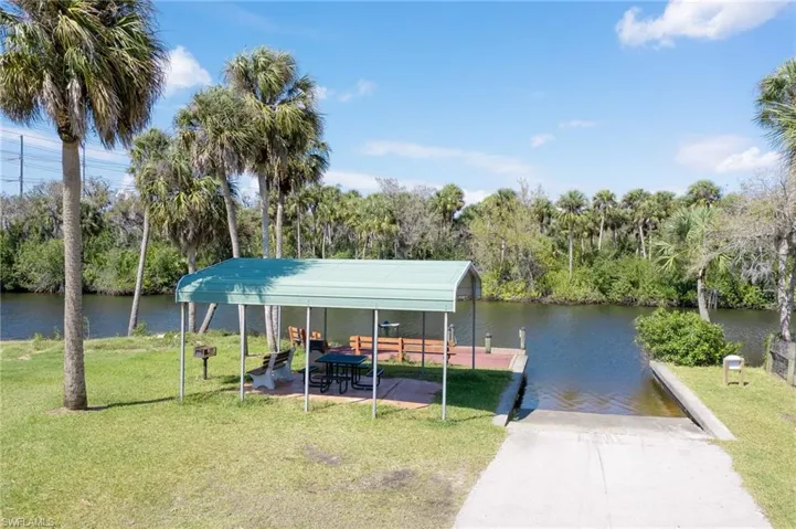 Covered picnic table with grill, dock, fish cleaning station and boat ramp overlooking the scenic Orange River.  Property across the river is deeded and protected land.