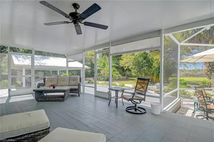 Spacious outdoor patio with extended deck outside off of the kitchen and living area overlooking the luscious landscaping that surrounds the property.