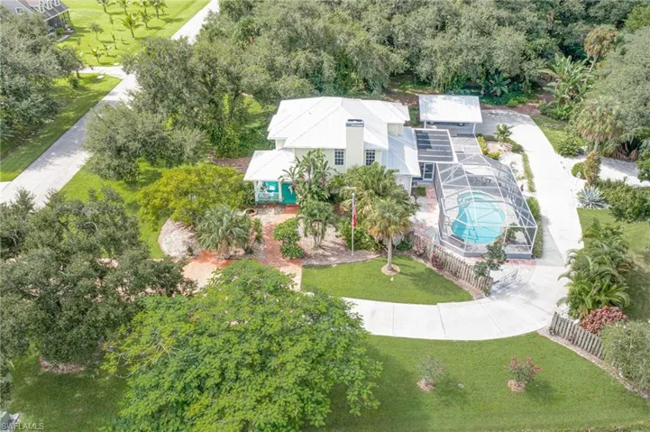 View showing the north side of the property.  Long circular driveway that leads to carport in the rear of property.