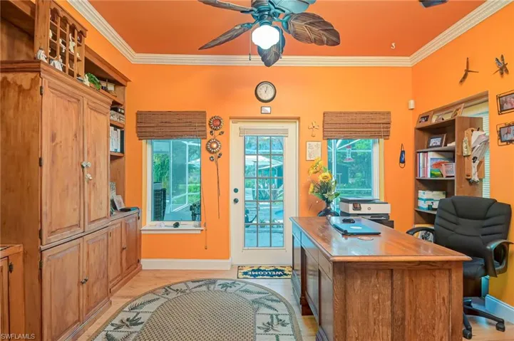 Nice office or den with crown molding, tile flooring and overlooking the pool and lanai.