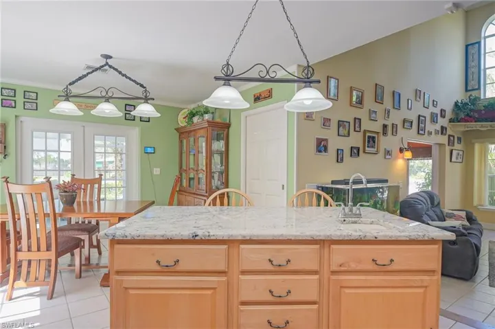 View of kitchen facing dining area, great room and laundry room.