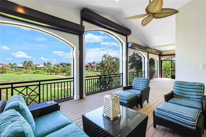 Wooden deck with a lawn and ceiling fan