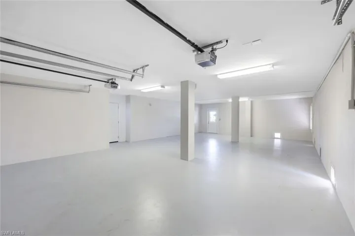 Garage featuring a garage door opener