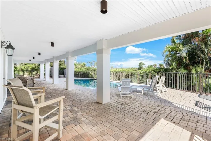 View of patio / terrace with a fenced in pool