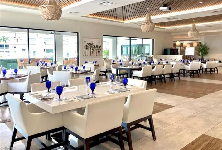 Dining space with wood ceiling, hardwood / wood-style flooring, and a healthy amount of sunlight