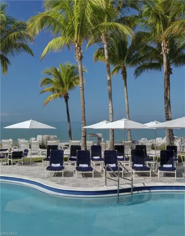 Floridian Beach Club - View of swimming pool featuring a water/beach view