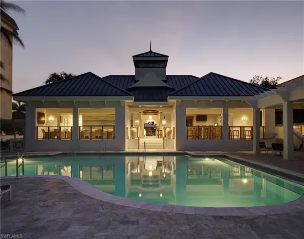 Floridian Club Pool at dusk with a patio