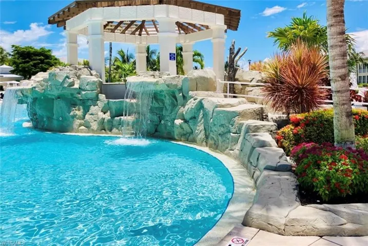View of swimming pool with pool water feature