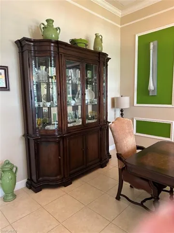 Tiled dining space with ornamental molding