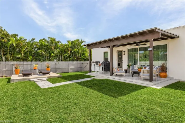 View of yard with an outdoor hangout area, a patio area, and ceiling fan