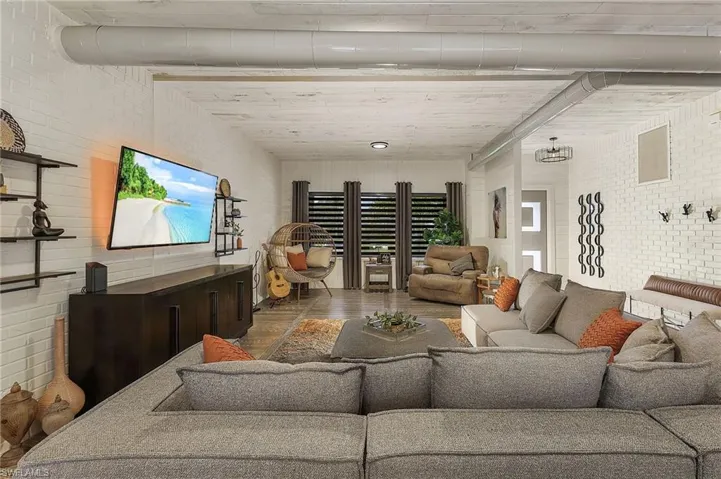 Living room with brick wall