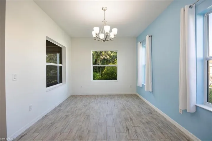 Large dining space with wood look tile