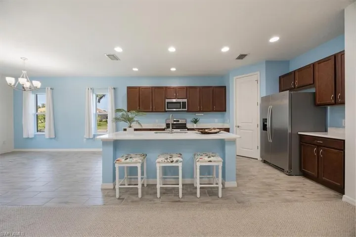 Connected to your dining space and painted a beautiful sky blue this room invites you to entertain and create wonderful meals for friends and family