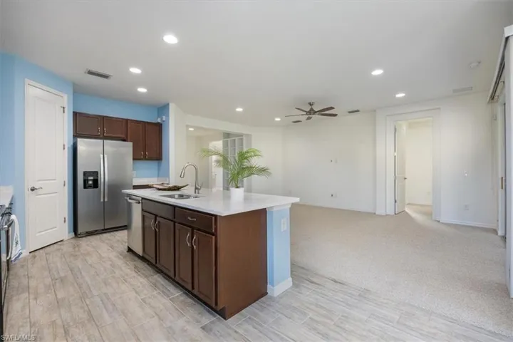 Kitchen offers stainless appliances, quartz counters and wooden cabinets