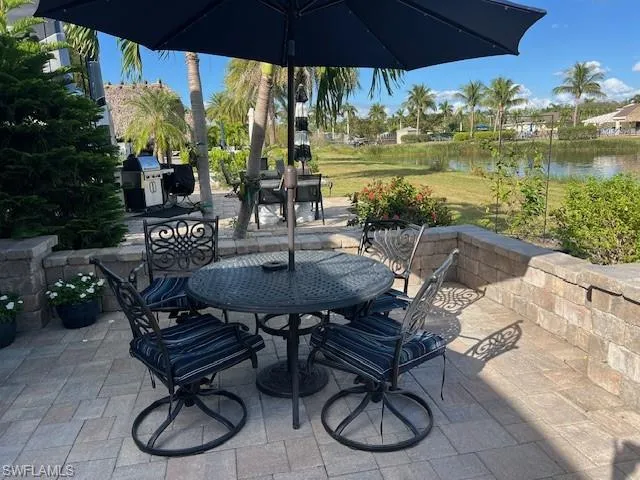 View of patio / terrace with a water view and area for grilling