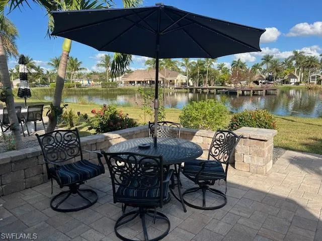 View of patio / terrace featuring a water view