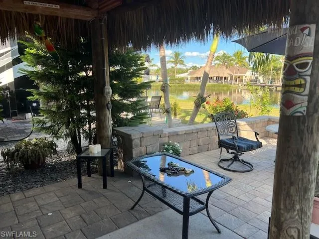 View of patio / terrace with a water view