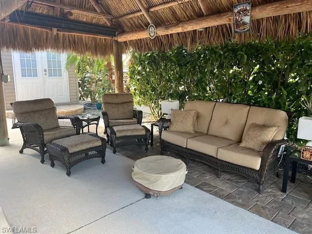 View of patio with a gazebo, outdoor lounge area, and french doors
