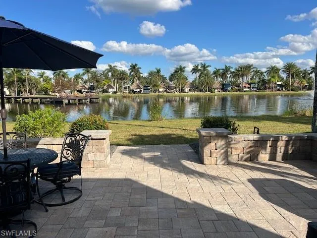 View of patio with a water view