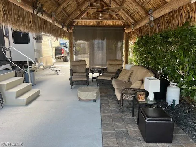 View of patio / terrace with a gazebo, ceiling fan, and an outdoor hangout area
