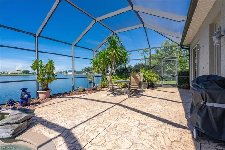 Sunroom / solarium with a water view