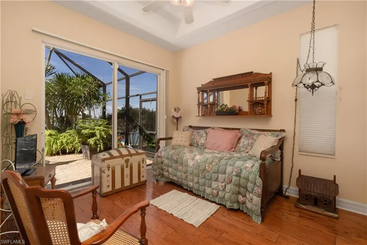 Bedroom with wood-type flooring and ceiling fan