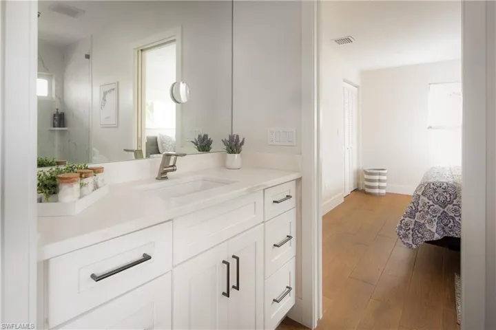 Bathroom featuring wood-type flooring and vanity