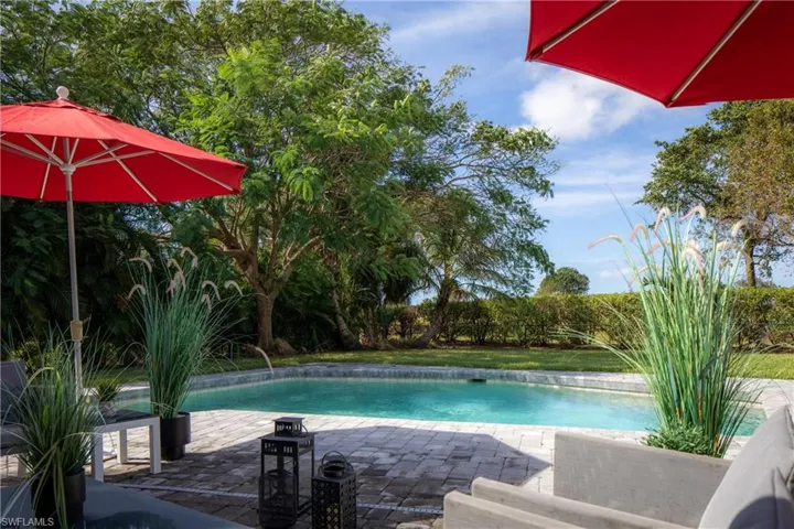 View of swimming pool featuring a patio and pool water feature