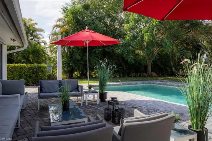 View of pool featuring a patio and pool water feature