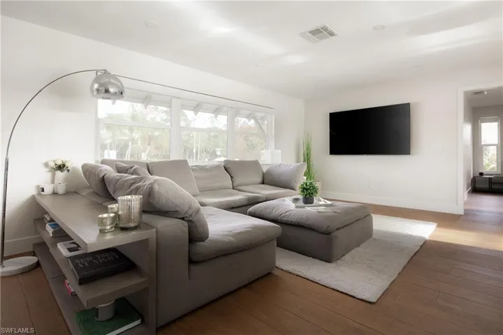 Living room with wood-type flooring