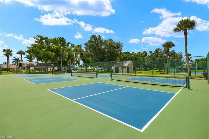 View of tennis court with community basketball court