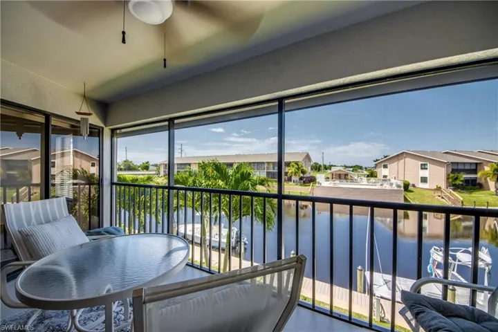 Screened in balcony with slider entry to primary bedroom