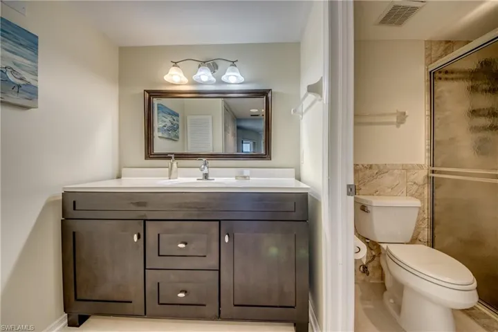 Ensuite bathroom with granite counters & ample storage