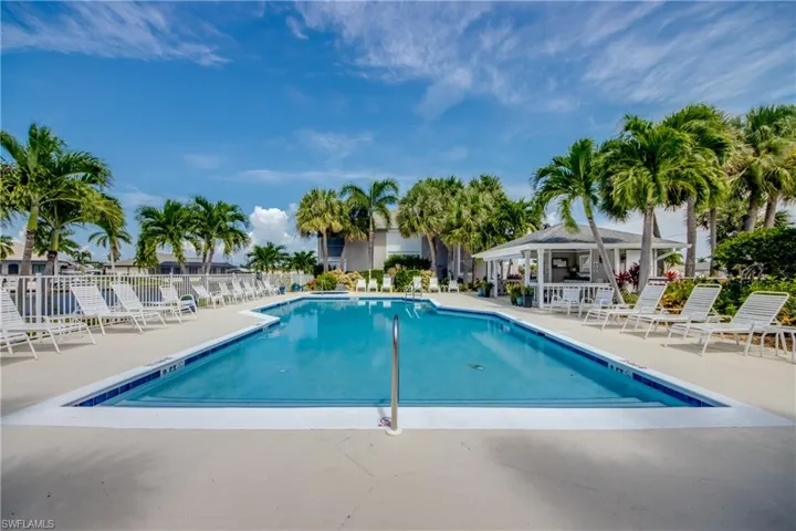 View of pool featuring a gazebo & large deck area