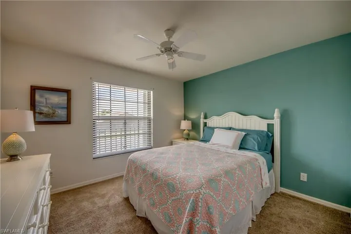 Large guest room with ceiling fan & oversized window