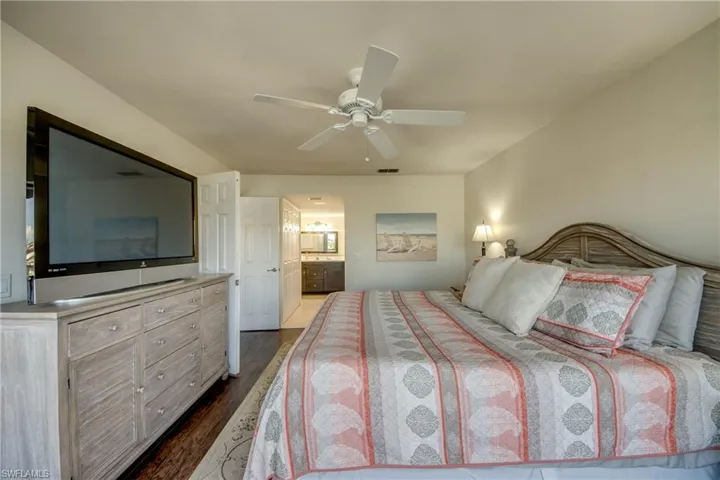 Large primary with ceiling fan & ensuite bath