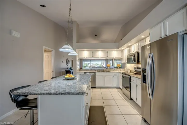 Expansive island with bar seating & SS appliances