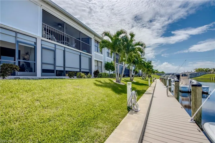 Expansive dock featuring tropical landscaping