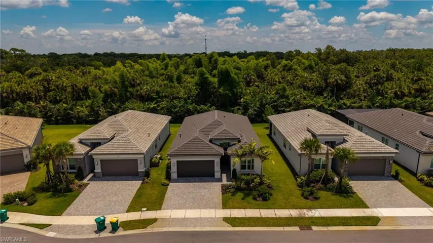 Modern single-story residence with a gray tile roof and a two-car garage