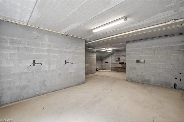 Concrete block walls with exposed conduits and fluorescent lighting