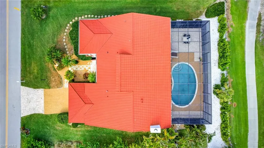 Aerial perspective showcasing a property with a vibrant orange tile roof