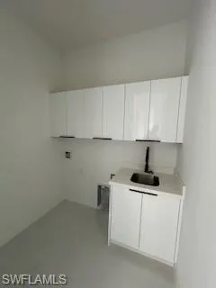 Washroom with cabinet space and hookup for a washing machine