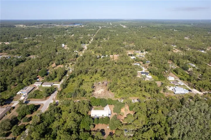 Bird's eye view with a wooded view