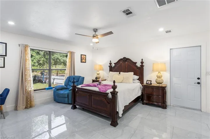 Bedroom featuring recessed lighting, visible vents, and baseboards